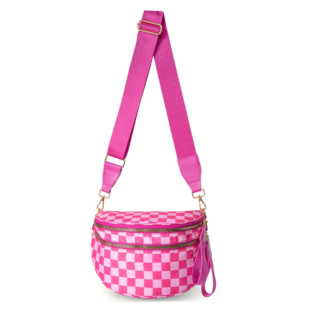 Pink checkered crossbody bag with wide adjustable strap and gold zipper details