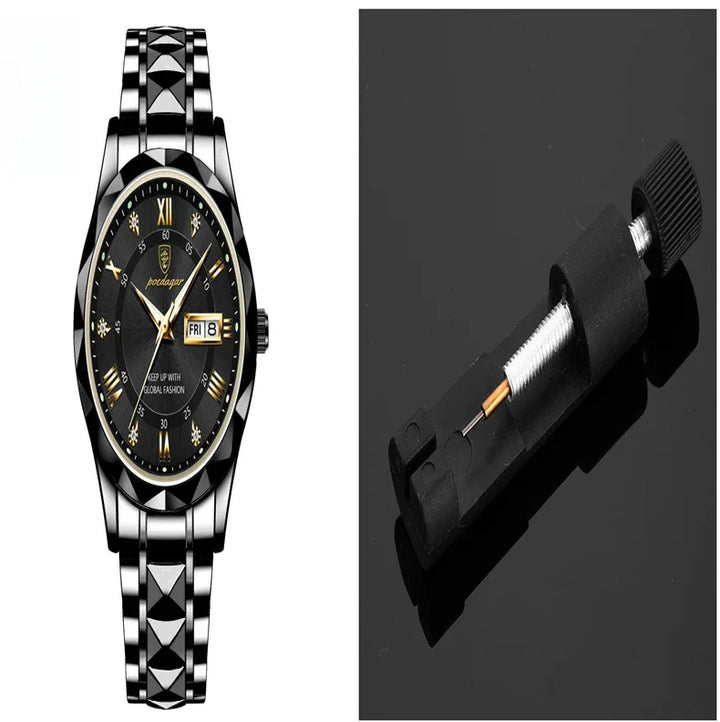 Black and silver men's wristwatch with Roman numerals and date display, next to a watch hand remover tool