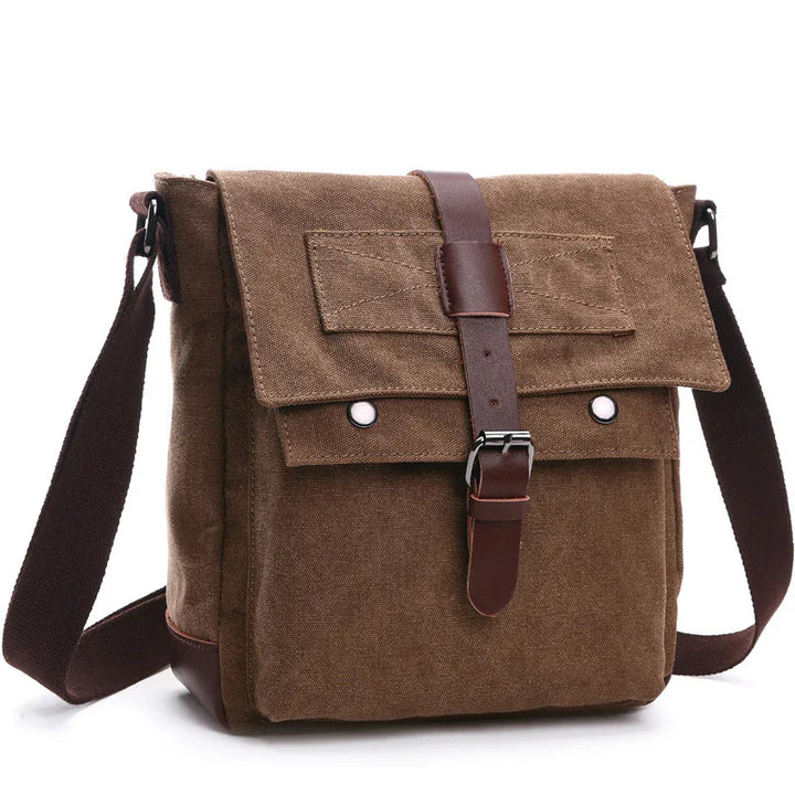 Brown canvas messenger bag with leather strap buckle and adjustable shoulder sling