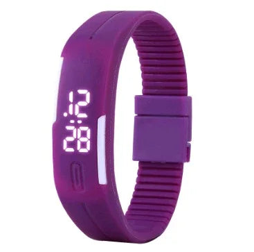 Purple digital LED wristwatch with flexible silicone band showing time 12:28