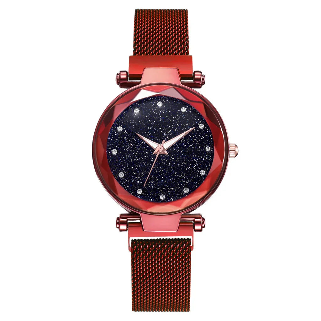 Red metal mesh strap wristwatch with starry dark blue dial and crystal hour markers
