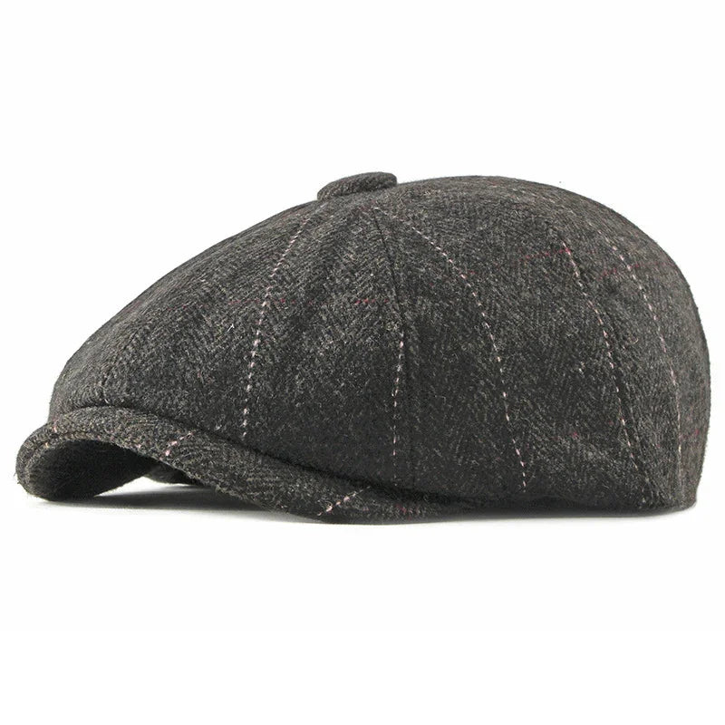 Dark gray wool newsboy cap with subtle pink stitching on white background