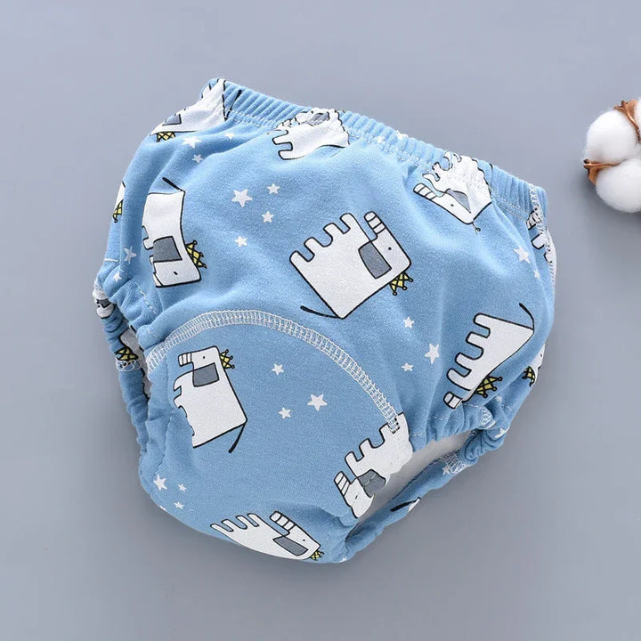 Blue baby training pants with white cartoon elephants and star patterns on a gray background