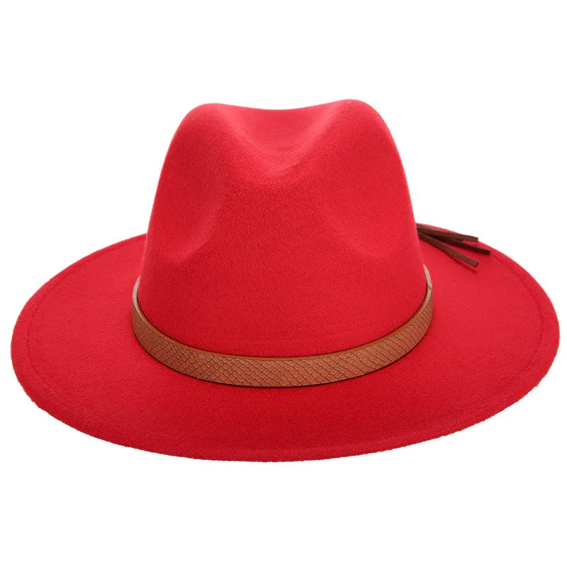 Red wide-brim fedora hat with brown textured leather band and tassel accents
