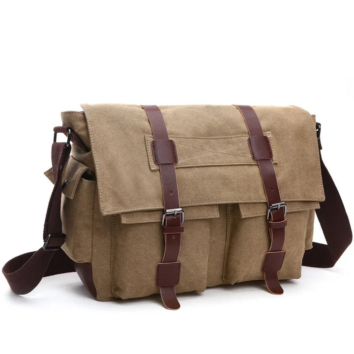 Brown canvas messenger bag with leather straps and buckles, adjustable shoulder strap