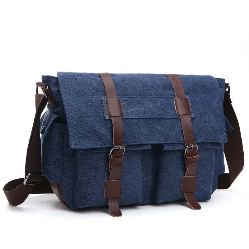 Blue canvas messenger bag with brown leather straps and multiple front pockets