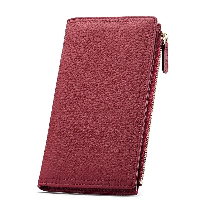 Elegant maroon leather wallet with textured surface and gold zipper detail