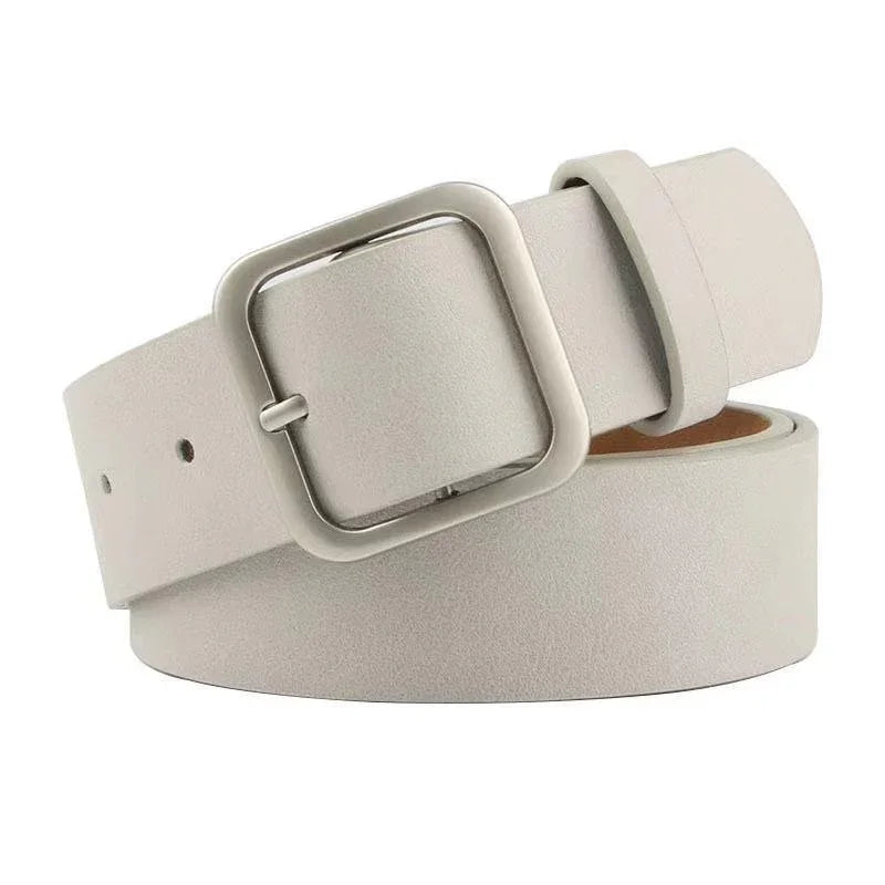 Minimalist light gray leather belt with a square metal buckle on white background
