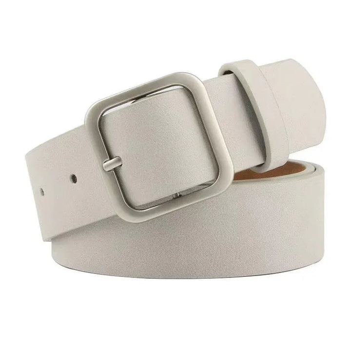 Minimalist light gray leather belt with a square metal buckle on white background