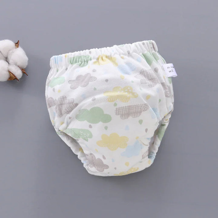 Soft cotton baby training pants with pastel cloud print on gray background
