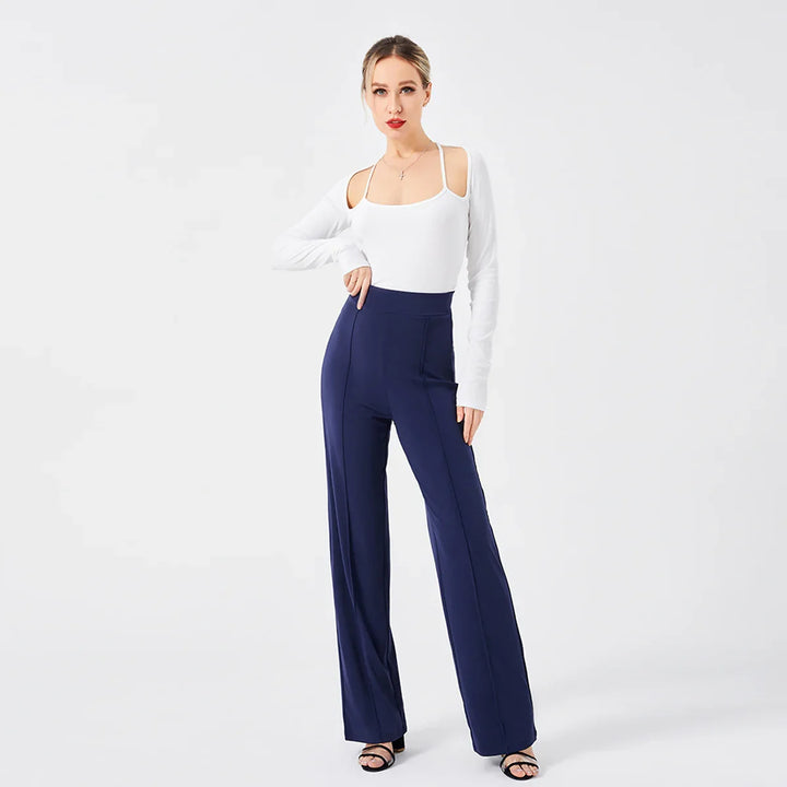 Fashion model wearing white cold shoulder top and high-waisted navy wide-leg pants