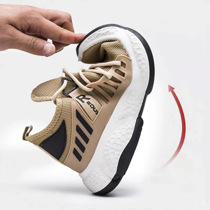 Flexible beige and black athletic shoe being bent by hand, highlighting its soft sole and breathable mesh