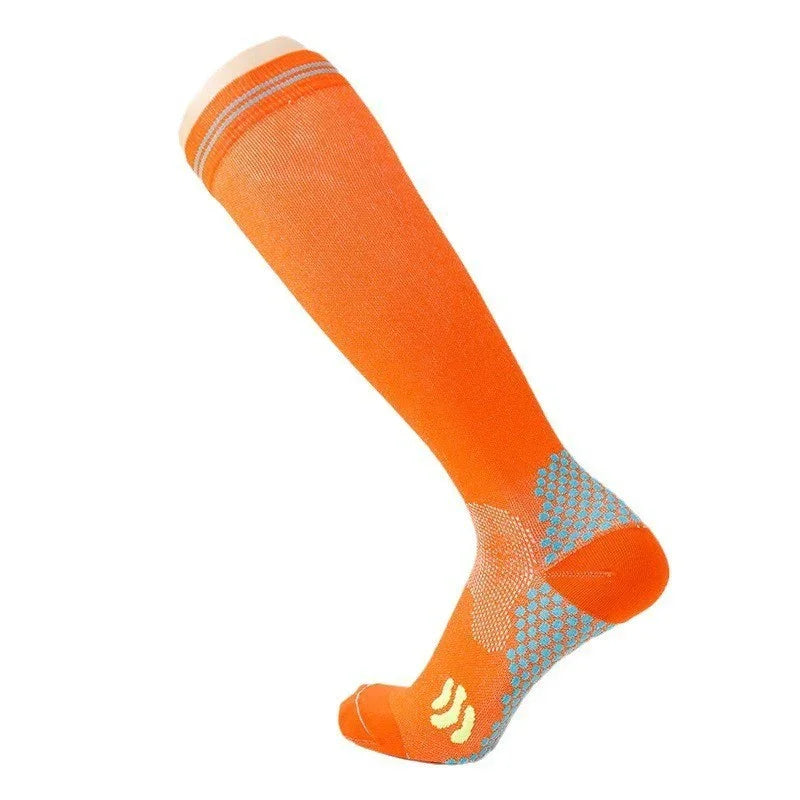 Bright orange knee-high compression sock with white stripes and gray grip pattern on sole