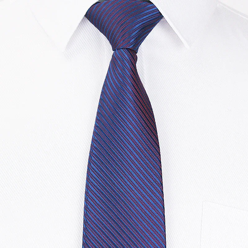 Blue and red striped necktie on white dress shirt collar