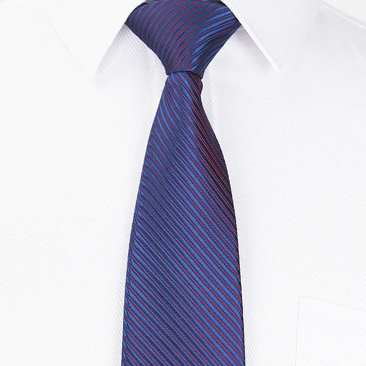 Blue and red striped necktie on white dress shirt collar