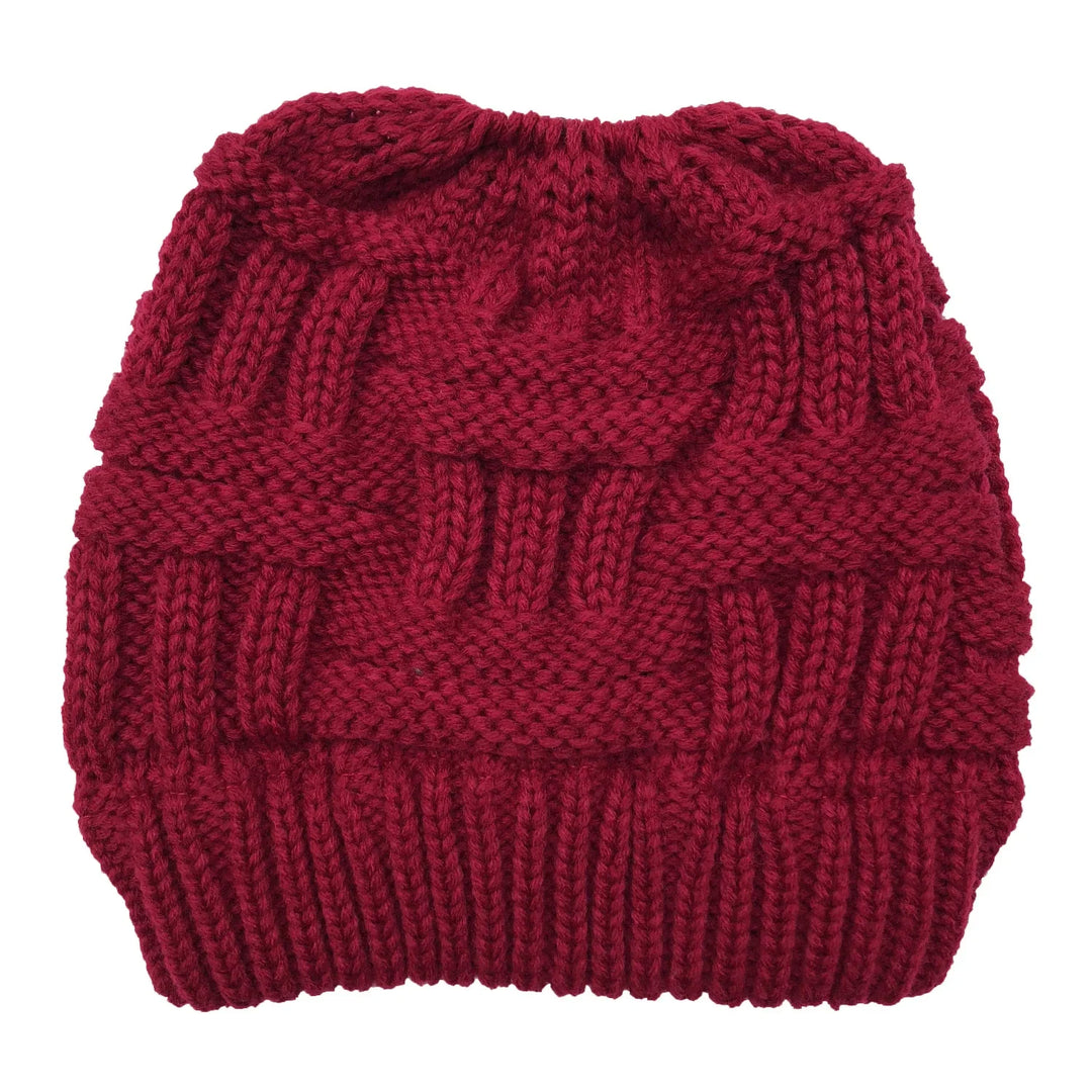 Red chunky knit beanie hat with textured cable knit pattern and ribbed brim