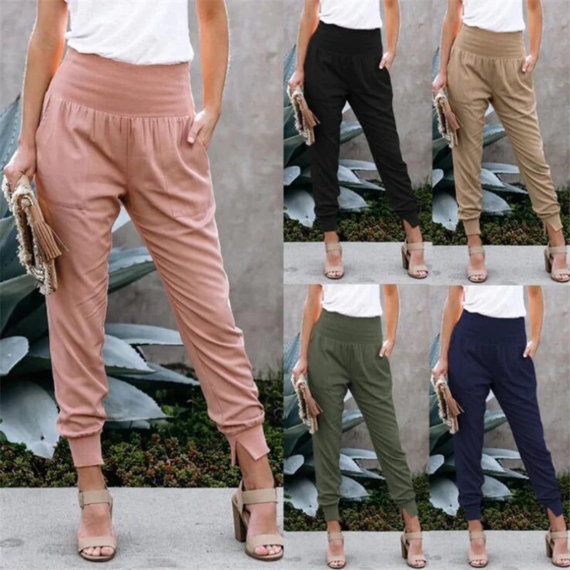 Women wearing high-waist tapered pants in pink, black, beige, olive, and navy with white tops and heeled sandals