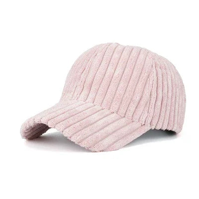 Soft pink ribbed fabric baseball cap with curved brim on white background