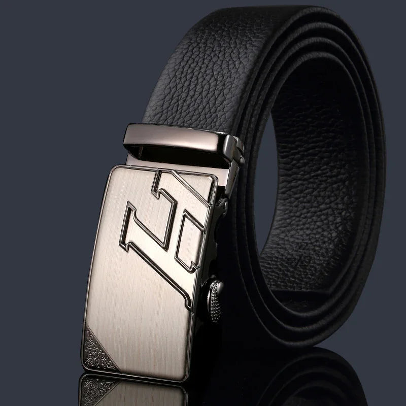 Black leather men's belt with textured strap and silver metallic buckle featuring stylized initials