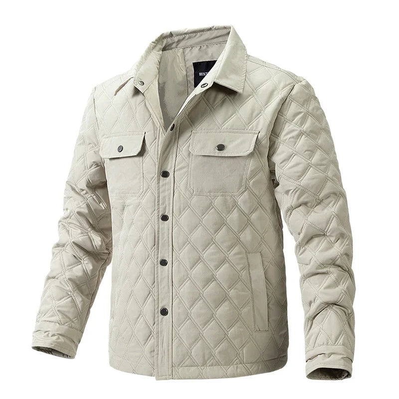 Beige quilted jacket with button closures and chest flap pockets on white background