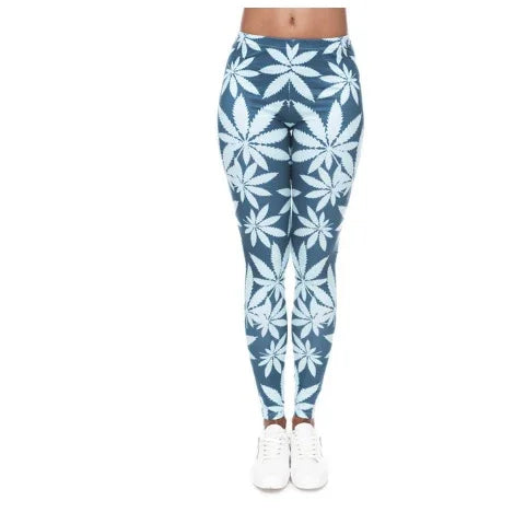 Front view of woman wearing blue leggings with large white cannabis leaf print and white sneakers