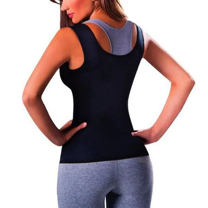 Woman wearing black waist trainer shapewear over gray activewear, back view on white background