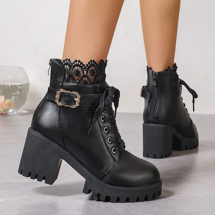 Black chunky heel ankle boots with lace trim, side zipper, buckle strap, and lace-up front
