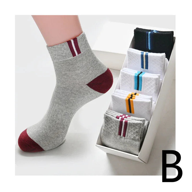 assorted cotton ankle socks with colored stripes and heel accents displayed in a white box