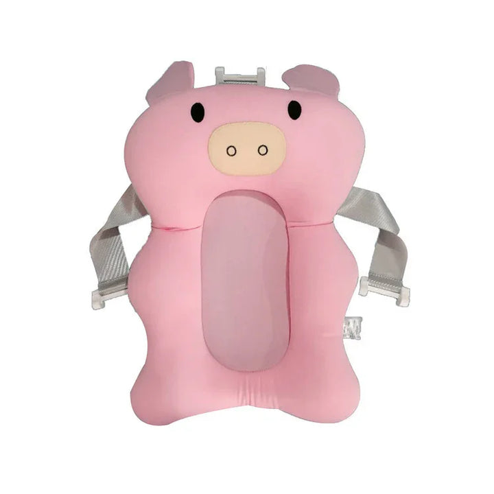 Pink pig-shaped baby bath cushion with adjustable safety straps on white background