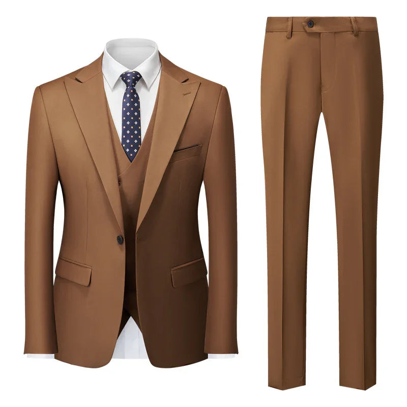 Men's brown suit jacket and matching trousers with white shirt and navy patterned tie