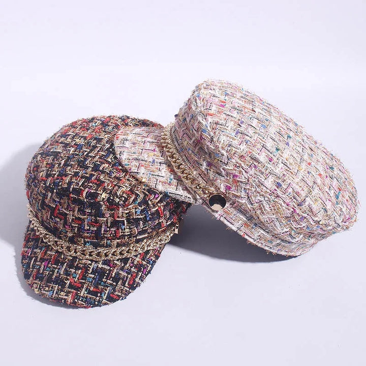 Two woven tweed fisherman caps in multicolor and pastel shades with gold chain detail