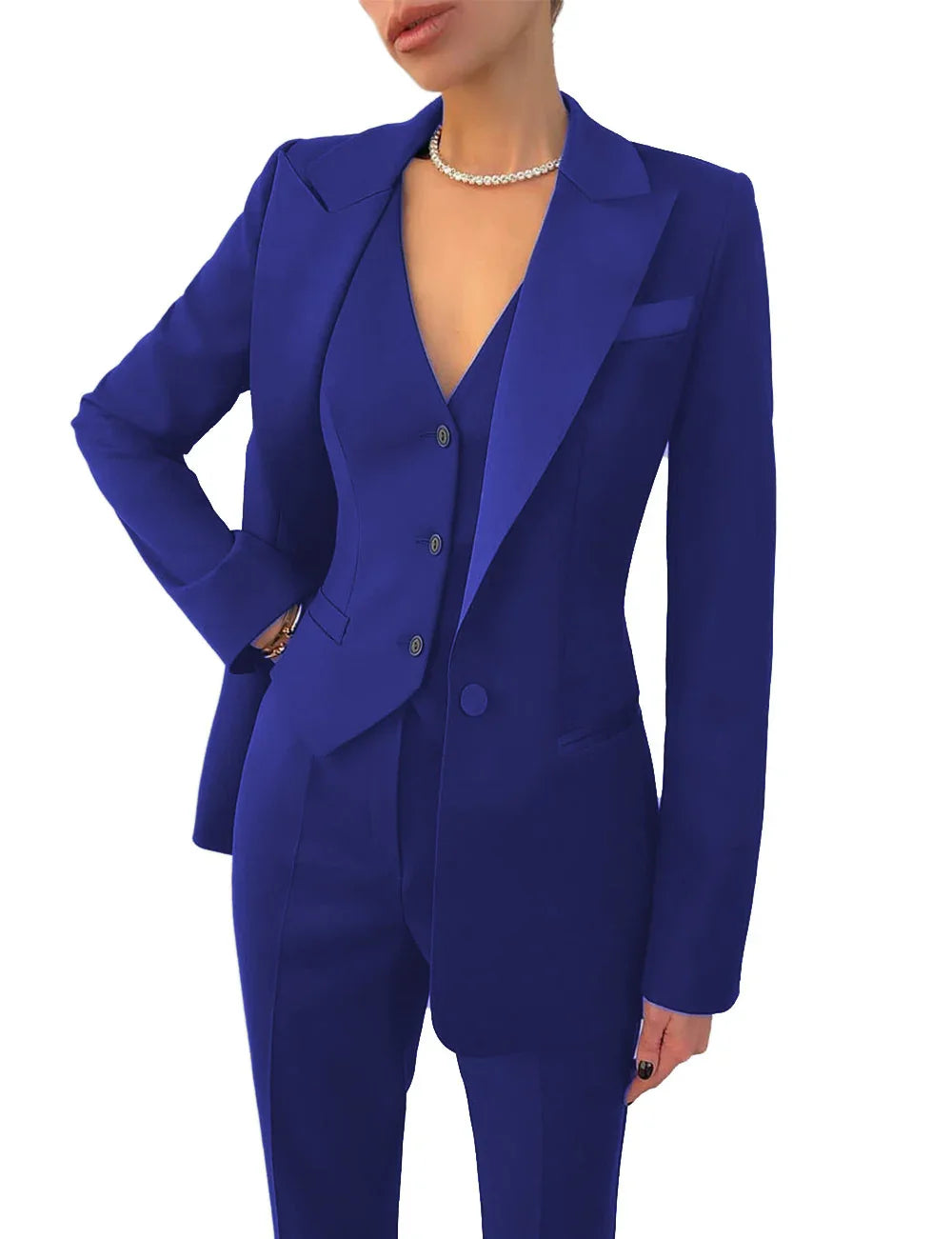 woman in royal blue tailored pantsuit with blazer and vest, wearing pearl necklace
