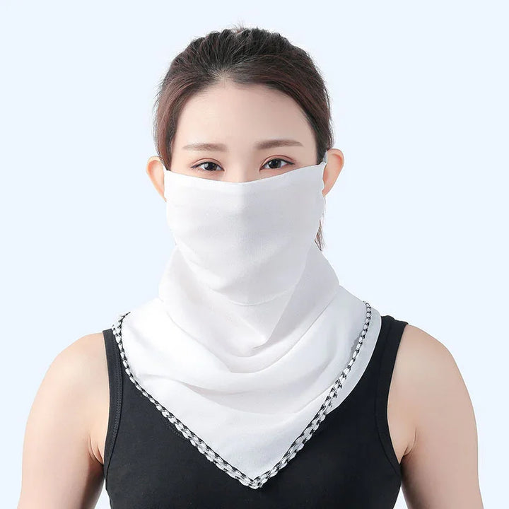 Woman wearing white UV protection face scarf and black sleeveless top on light background