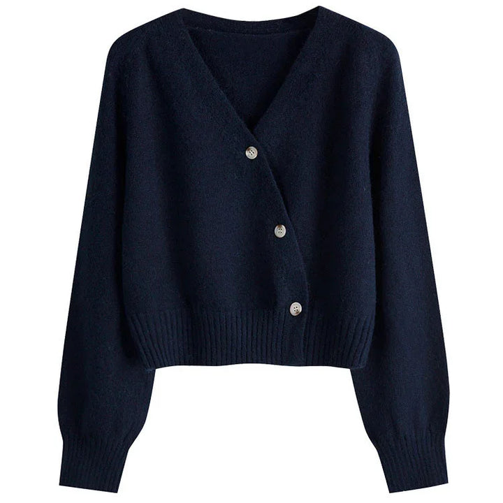 Navy blue cropped cardigan sweater with V-neck and three silver buttons on white background