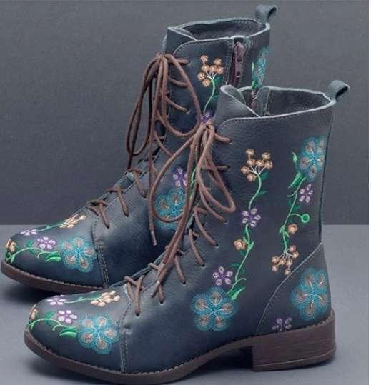 Dark blue leather lace-up boots with colorful embroidered floral designs and side zipper