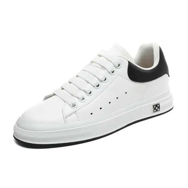 White leather sneaker with black heel accent, white laces, perforated side holes, and rubber sole
