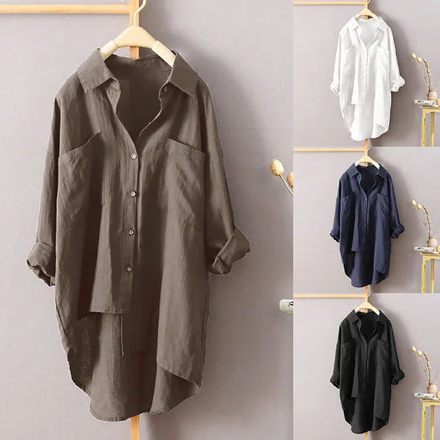 Loose fit long sleeve button-up shirts in brown, white, navy blue, and black on wooden hangers