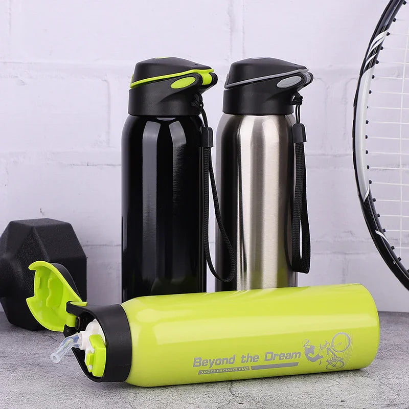 Three sports water bottles with flip lids, next to a dumbbell and tennis racket on a gray surface