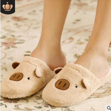 Person wearing cozy beige pig-themed plush slippers on a floral rug