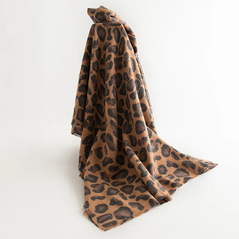 Soft brown and black leopard print fabric draped on white background