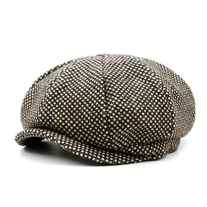 Brown and beige checkered newsboy cap with a curved brim on white background