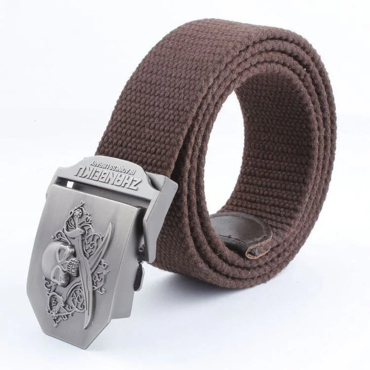 Brown woven fabric belt with silver metal buckle featuring skull and crossed swords design
