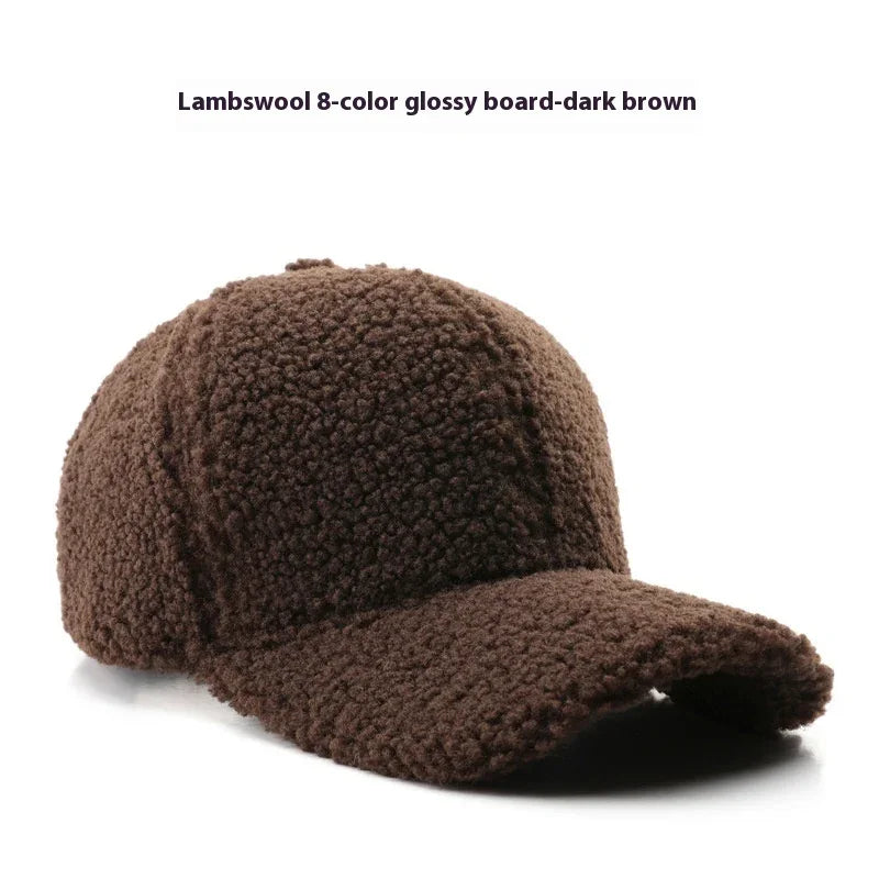 Dark brown lambswool baseball cap with textured, fuzzy material on white background