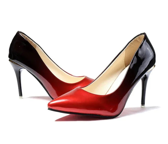 Pair of shiny red and black gradient high-heeled women's pumps with pointed toes