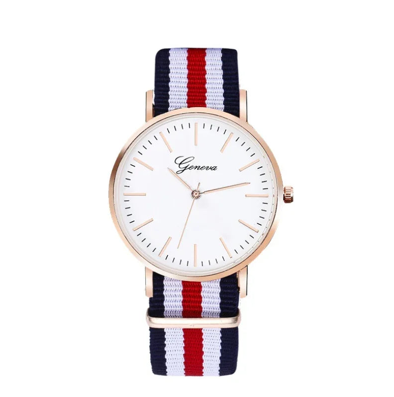 Geneva watch with white dial, rose gold case, and navy, white, red striped nylon strap