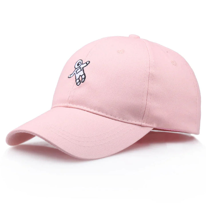 Pink baseball cap with small embroidered astronaut design on front