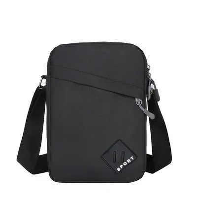 Black compact crossbody sport bag with front zip pocket and adjustable shoulder strap