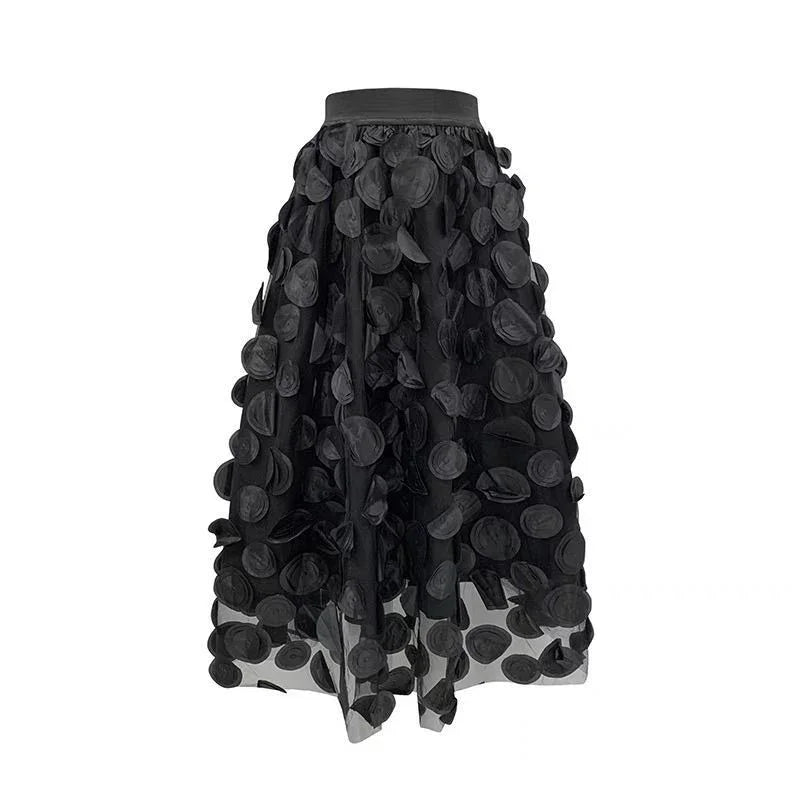 Black mid-length skirt with 3D circular appliqué details and sheer fabric overlay