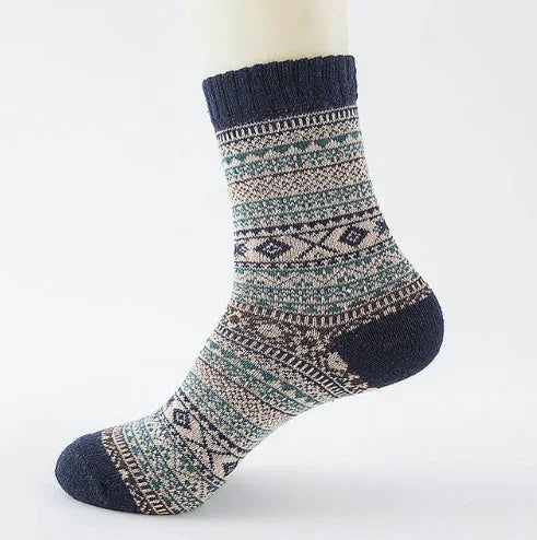 Cozy patterned wool socks with navy blue heel, toe, and cuff featuring geometric designs