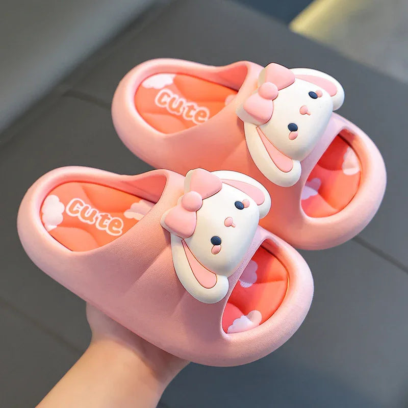 Pink cute indoor slippers with bunny face and bow design, cushioned sole with cloud pattern